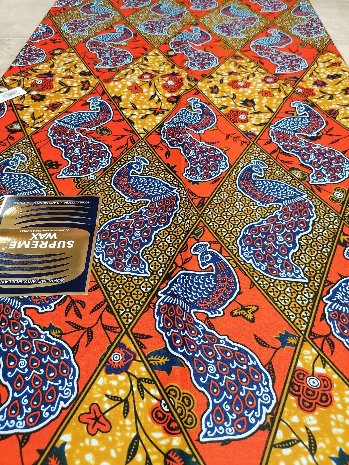 Africká látka měkčí,Supreme wax,pávi na červené